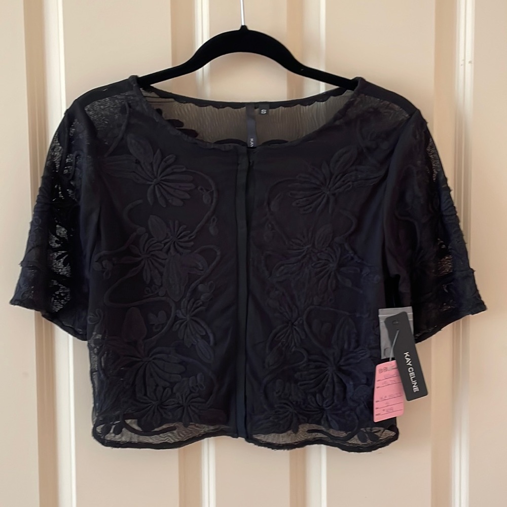 Kay Celine black sheer top with floral design.